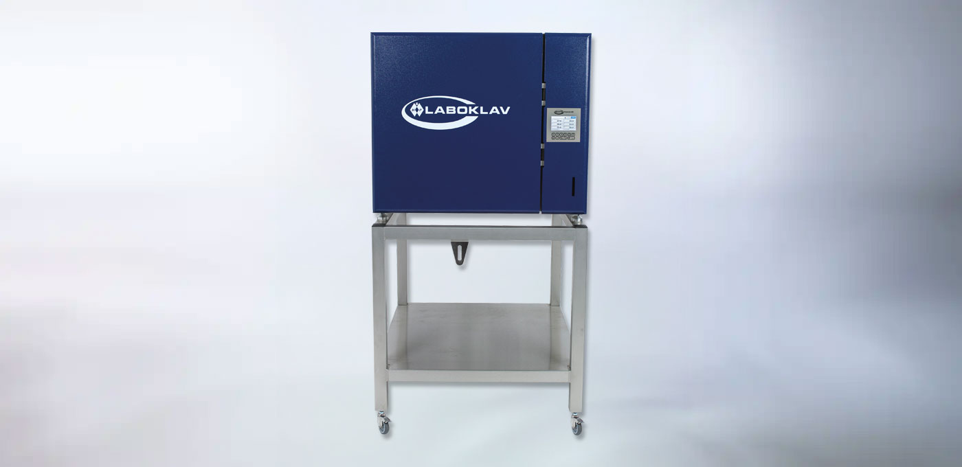 Woman operates sterilization machine Woman operates sterilization machine